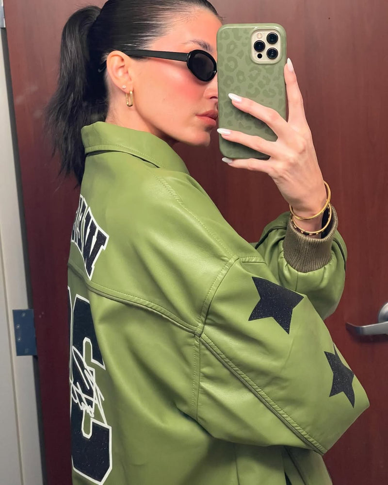 Woman in green hoodie and sunglasses taking selfie with olive green phone case
